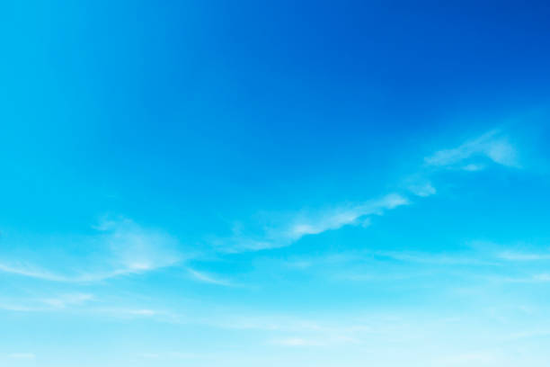 istock Fluffy blue sky background and white clouds soft focus, and copy space 1124961041