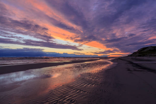 istock Colorful the sea sunset with  orange-violet paints 1124965621