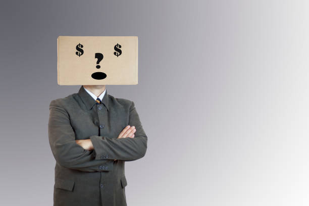 istock Man with a box on his head, sign $ 1124971822