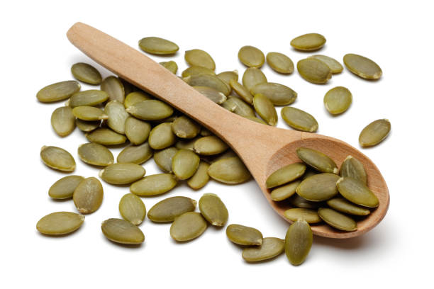 istock Peeled pumpkin seeds in spoon 1124974135