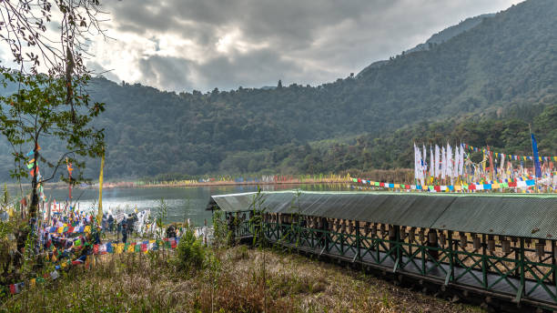 Khecheopalri Lake Khecheopalri Lake, originally known as Kha-Chot-Palri, is a lake located near Khecheopalri village. This is a Holy Lake. buddhist prayer wheel stock pictures, royalty-free photos & images