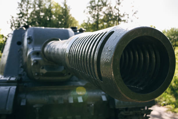 istock Old tank from the Second World war standing outdoors in the green forest. Armored fighting vehicle as a memory monument in peaceful times. No war concept. 1124978516
