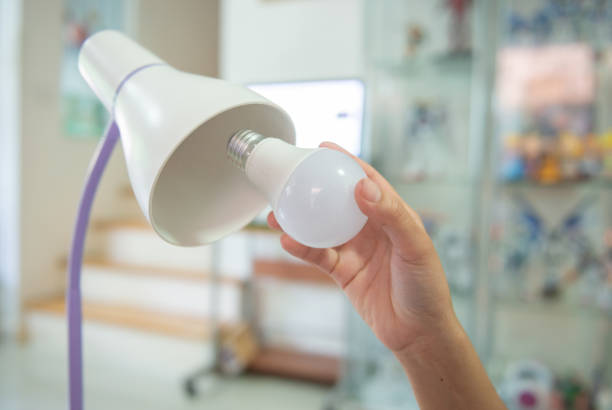 istock Changing the bulb to LED to install in the lamp for energy saving 1124982761