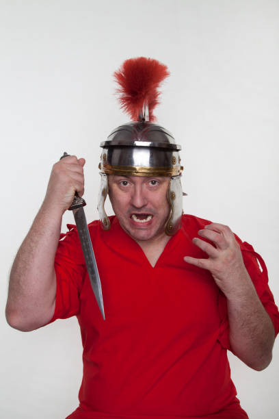 istock A roman soldier with with a dagger, knife on the white background. 1124982800