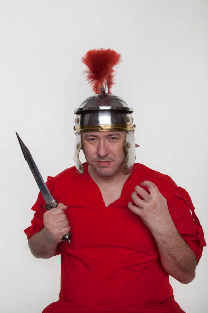 istock A roman soldier with with a dagger, knife on the white background. 1124982904