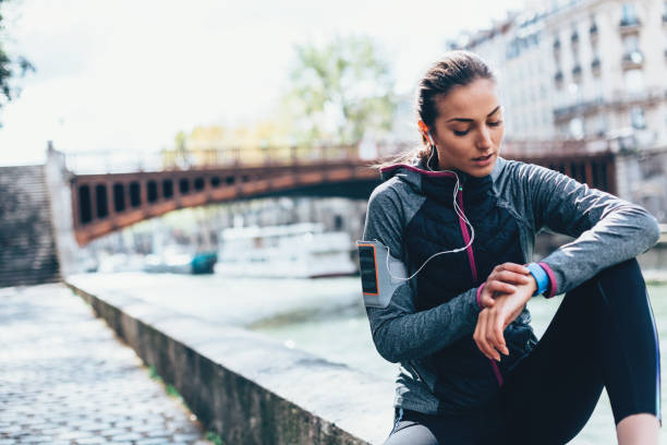 istock Sportswoman checking her smart watch 1124982994