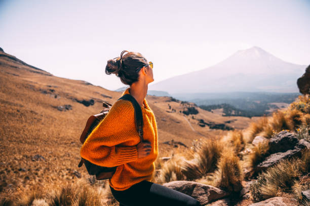 Enjoying the view. Young Latin woman enjoying the view to Popocatepetl volcano argentinian ethnicity photos stock pictures, royalty-free photos & images
