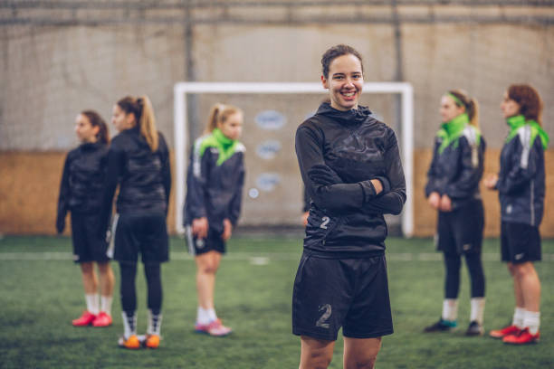 istock Cute girl soccer player smiling 1124986350