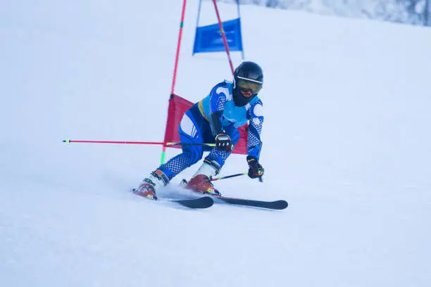 Athlete engaged in the race of super g , giant slalom downhill alpine ski racer professional