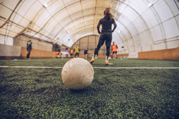 istock Women football training indoors 1124986970