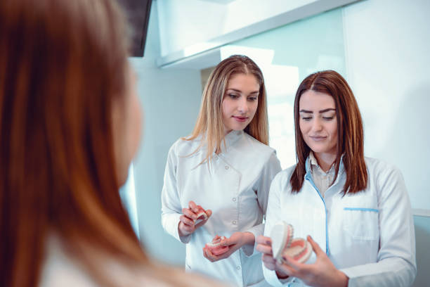 istock Female Dentist Students Having Exam About Braces 1124990952