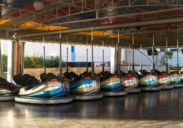 istock Amusement park bumper cars in a line 1124993959