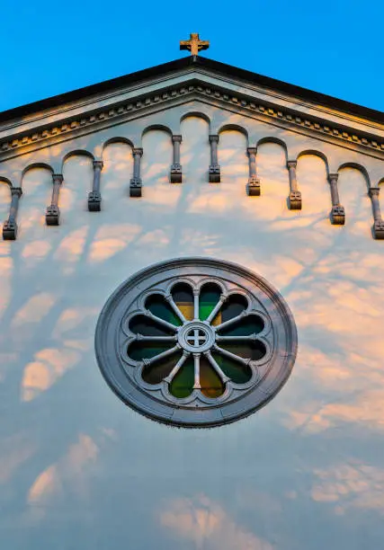 Church vitrage window in sunset time.