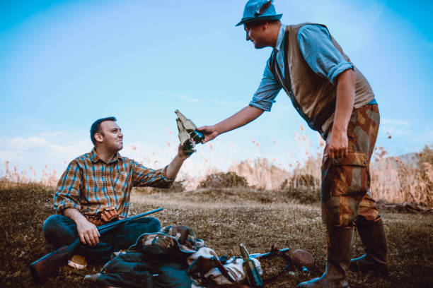 Two Hunters Making A Celebratory Toast After Successful Action