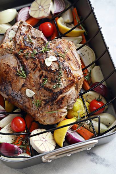 istock Easter lamb roast with vegetables and herbs ready for roasting 1124996719