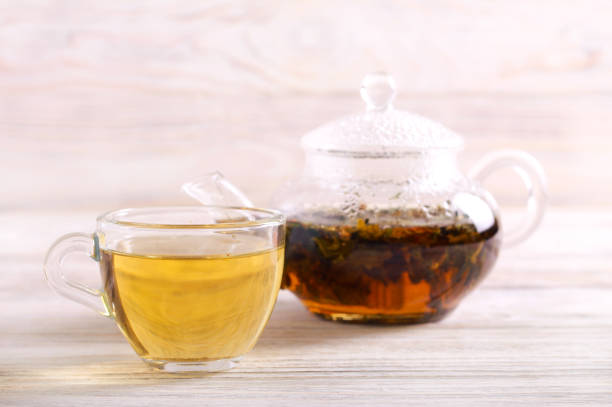 istock Pouring hot herbal tea in a cup 1124999482