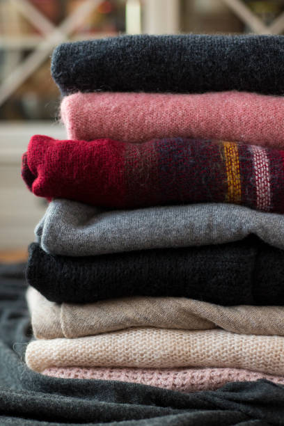 istock Pile of colorful sweaters background 1125001930