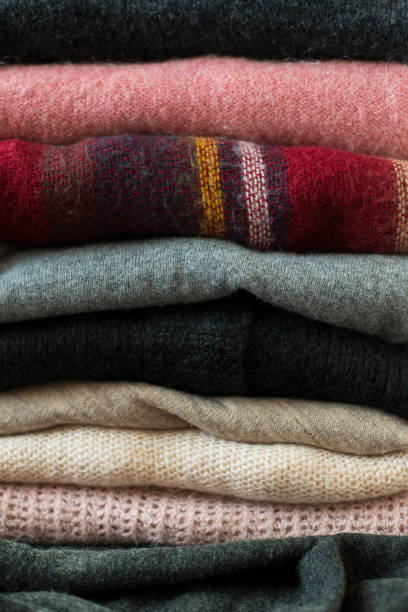 istock Pile of colorful sweaters background 1125001931