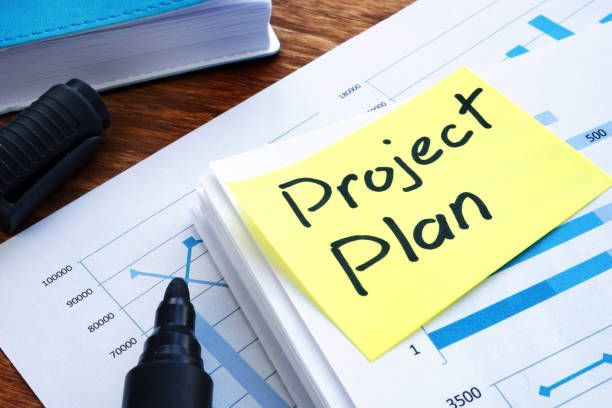 istock Project Plan and business papers on a desk. 1125002315