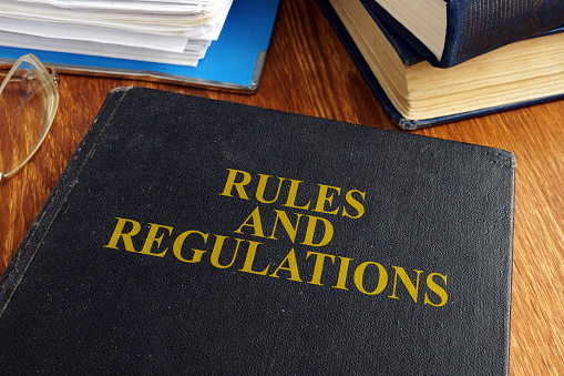 Rules and regulations book on the desk.