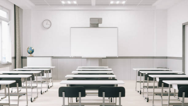 Empty Modern Classroom With Interactive Whiteboard (World Map Credits To NASA) Interior of an empty modern classroom with interactive whiteboard. empty desk in classroom stock pictures, royalty-free photos & images