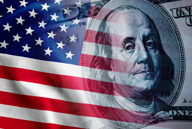 istock Composite of the US flag and 100 dollar bill 1125011331
