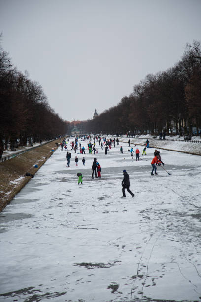 istock Nymphenburger canal with skaters, munich 1125011485