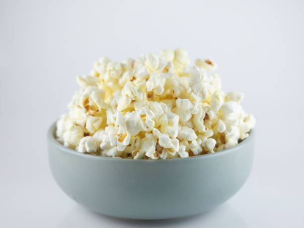 istock Popcorn in bowl isolated on white background 1125013403
