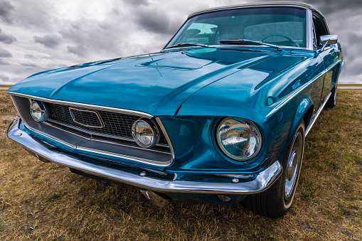 Side view of a tough american muscle car. By using a wide angle, the shapes are slightly emphasized so that the rugged appearance is even better