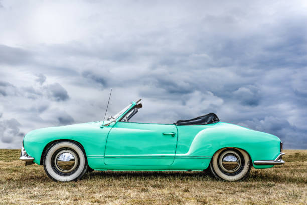 Side view of a beautiful european covertible. Side view of a beautiful european covertible. The fabric hood is down so you can drive with an open roof. convertible photos stock pictures, royalty-free photos & images
