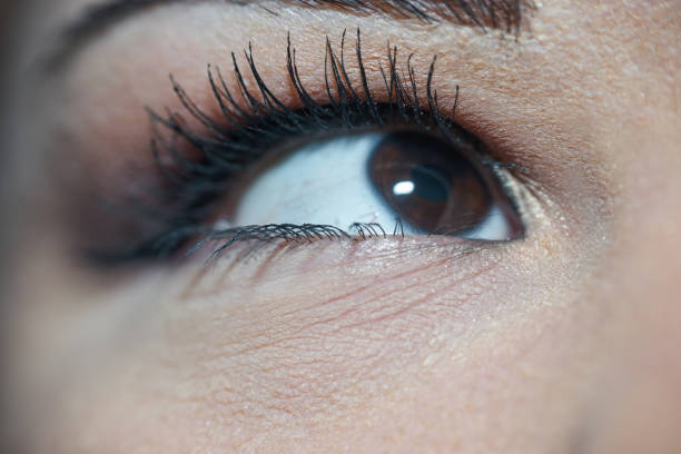 Making make-up herself in her eyes.
