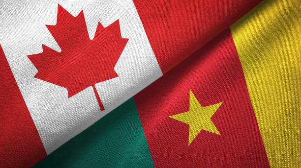 istock Cameroon and Canada two flags together textile cloth, fabric texture 1125020215