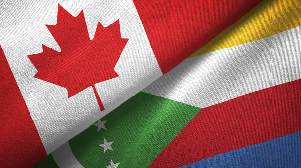 istock Comoros and Canada two flags together textile cloth, fabric texture 1125020239