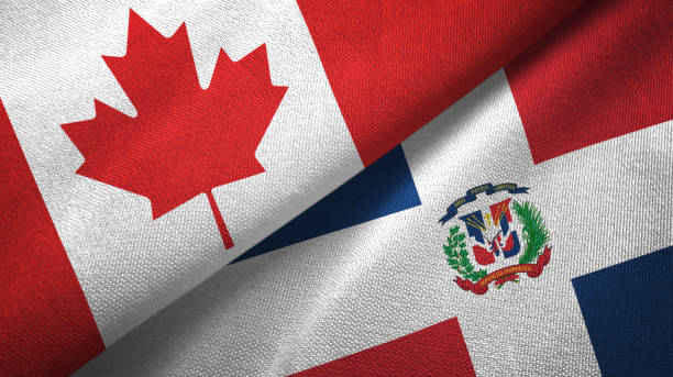 istock Dominican Republic and Canada two flags together textile cloth, fabric texture 1125020342