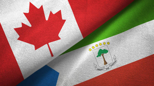 istock Equatorial Guinea and Canada two flags together textile cloth, fabric texture 1125020377
