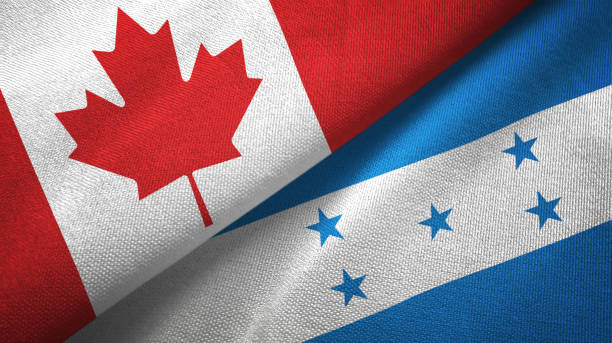 istock Honduras and Canada two flags together textile cloth, fabric texture 1125020479
