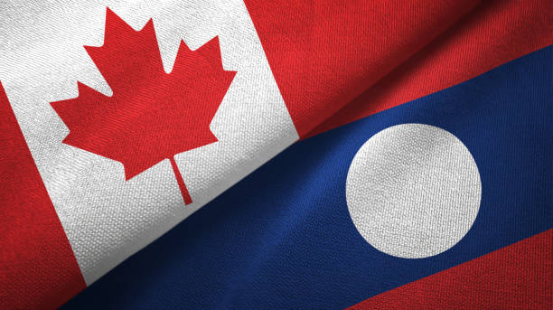 istock Laos and Canada two flags together textile cloth, fabric texture 1125020504