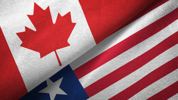 istock Liberia and Canada two flags together textile cloth, fabric texture 1125020516