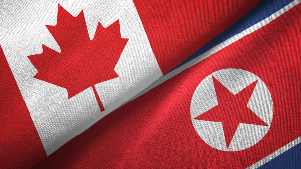 istock North Korea and Canada two flags together textile cloth, fabric texture 1125020626