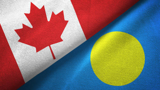 istock Palau and Canada two flags together textile cloth, fabric texture 1125020648