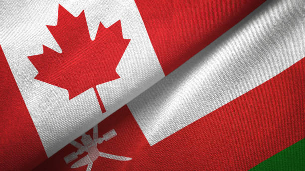 istock Oman and Canada two flags together textile cloth, fabric texture 1125021176