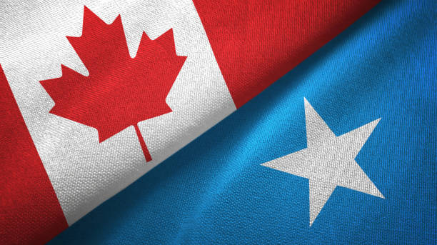 istock Somalia and Canada two flags together textile cloth, fabric texture 1125021224