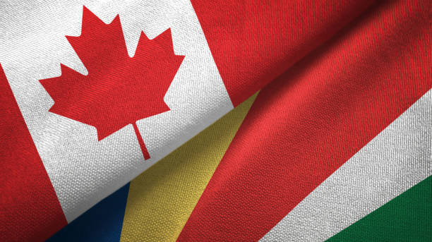 istock Seychelles and Canada two flags together textile cloth, fabric texture 1125021512