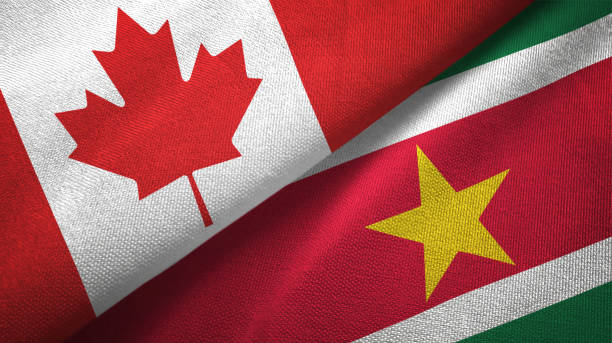 istock Suriname and Canada two flags together textile cloth, fabric texture 1125021773