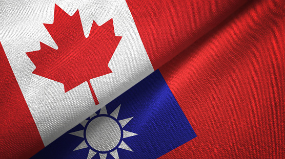 Taiwan and Canada flags together textile cloth, fabric texture