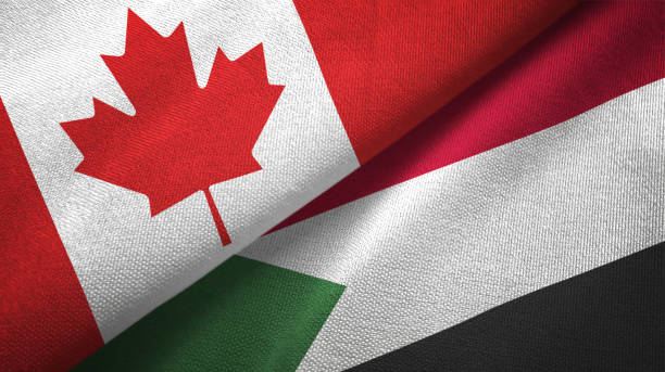 istock Sudan and Canada two flags together textile cloth, fabric texture 1125021786