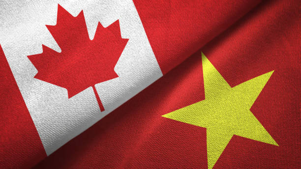 istock Vietnam and Canada two flags together textile cloth, fabric texture 1125022378