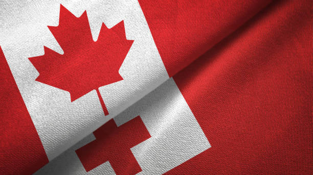 istock Tonga and Canada two flags together textile cloth, fabric texture 1125022381