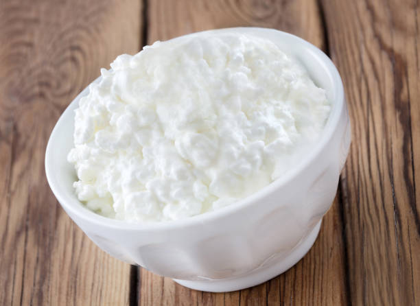 istock Cottage Cheese and wooden background 1125024366