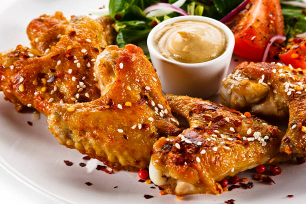istock Grilled chicken wings on white background 1125024732